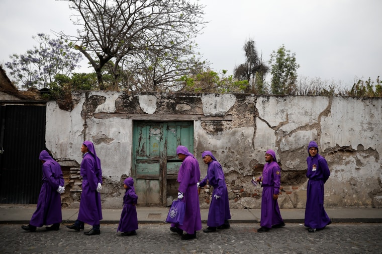 Image: Catholic faithfuls take part in the Procession of Jesus Nazareno de la Humildad during Easter celebrations in Antigua