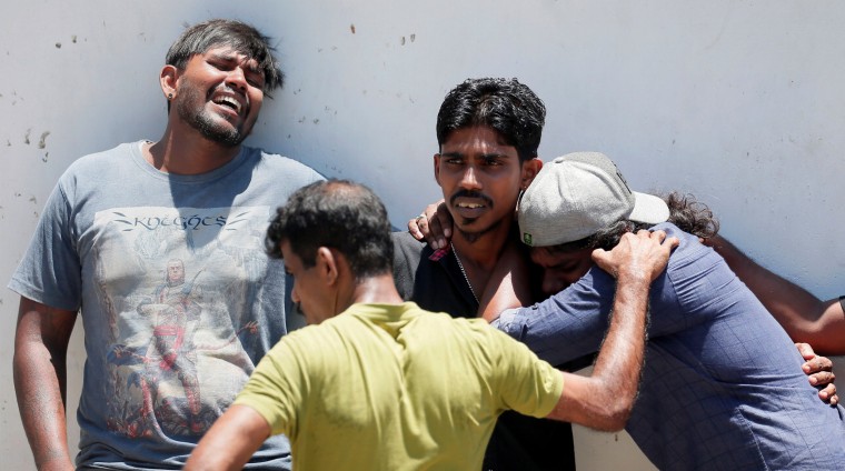 Image: Relatives of a victim mourn in Colombo, Sri Lanka, on Sunday