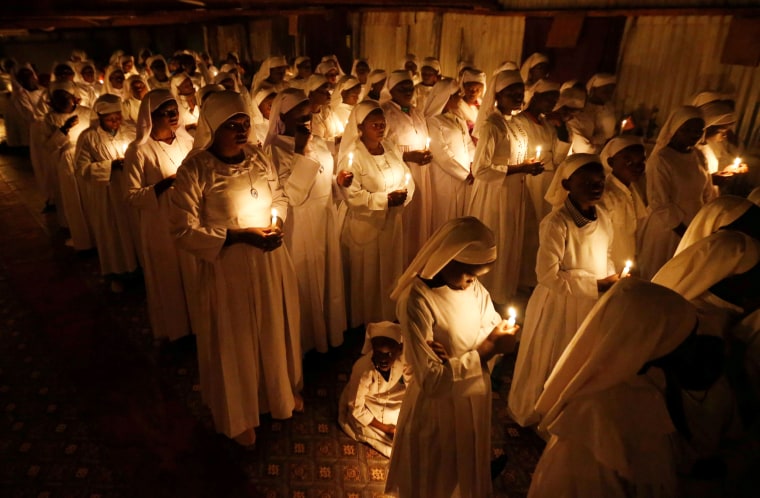 Image: Devotees of the Legio Maria African Mission Church hold candles at Easter mass near Nairobi, Kenya, on April 20.