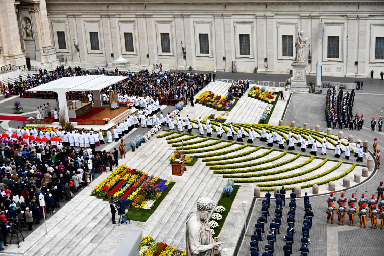 Image: St. Peter's Square is decorated with flowers as Pope Francis holds Easter mass at the Vatican on April 21.