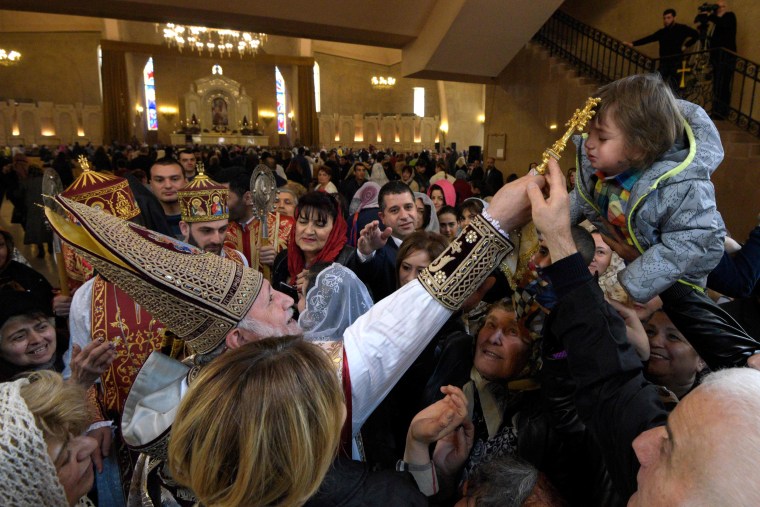 Image: Catholicos Garegin II, the head of the Armenian Apostolic Church, leads Easter service in Yerevan on April 21.
