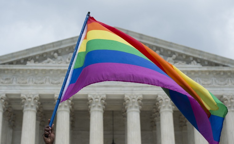 Image: A rainbow flag is flown outside the Supreme Court in Washington, DC