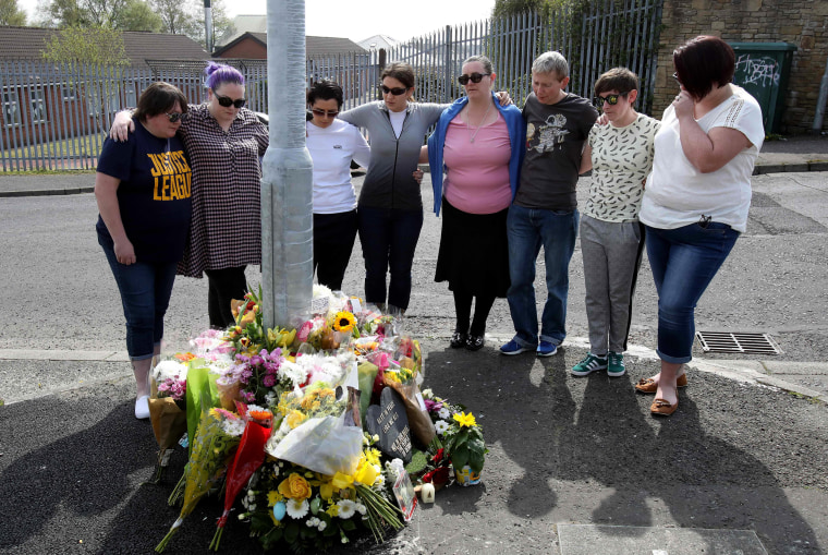 Image: Mourners gather around a floral memorial for Lyra McKee after she was fatally shot two days earlier in Londonderry, Norther Ireland, on April 20, 2019.