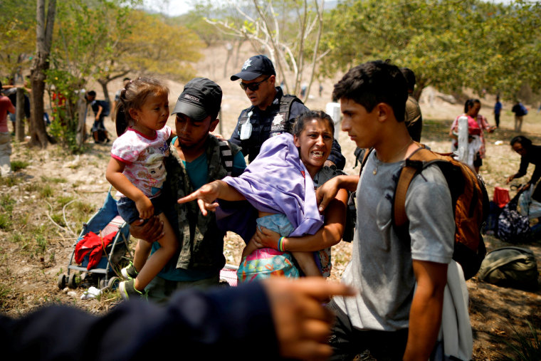 Image: A migrant family is detained by police during a raid in Pijijiapan, Mexico, on April 22, 2019.