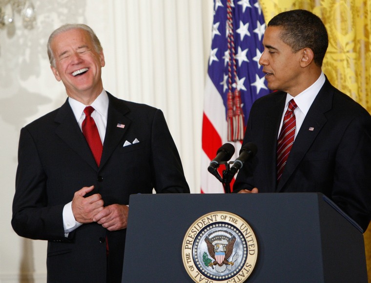 Image: Vice President Joe Biden laughs during a light moment as President Barack Obama speaks in the East Room of the White House