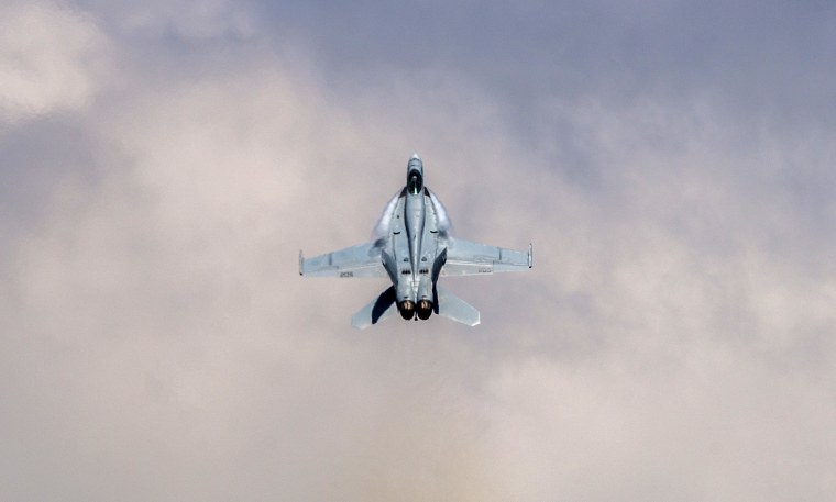 Image: An F/A-18 Super Hornet executes tactical maneuvers at an air show at Scott Air Force Base in Illinois on June 11, 2017.