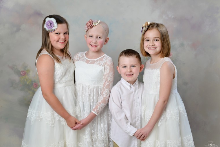 Connor Lloyd, 4, who is being treated for a form of leukemia, joined the girls in the photo shoot for a second straight year.