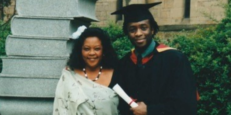 Rutagarama with his mother at his college graduation.