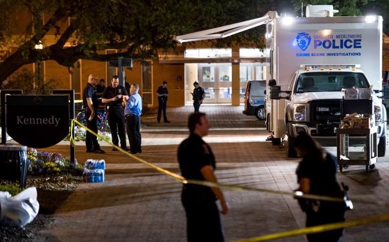 Image: Charlotte-Mecklenburg crime scene investigators outside of the Kennedy building on the University of North Carolina at Charlotte campus after a gunman killed two people on May 1, 2019.