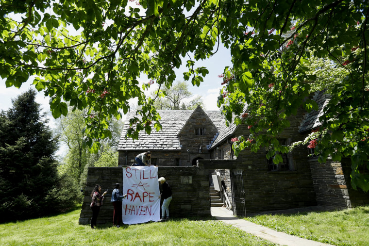 Image: Swarthmore College students hang a banner at the Phi Psi fraternity house during a sit-in on April 29, 2019.