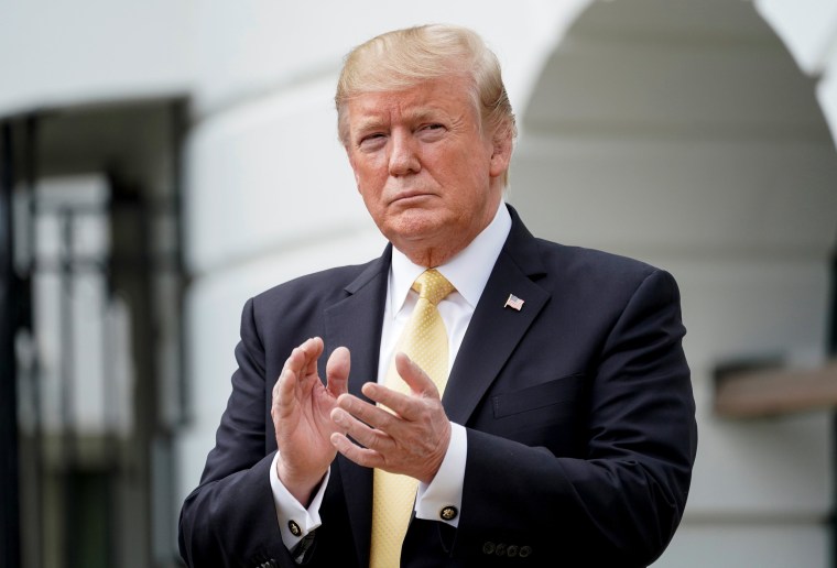 President Donald Trump applauds during an event at the White House on April 30, 2019.