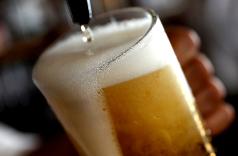 Image: FILE PHOTO: A pint of beer is poured into a glass in a bar in London