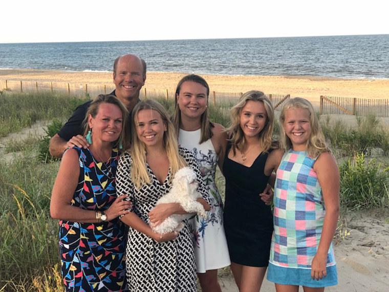 Former Rep. John Delaney with his wife April, daughters Grace, Lily, Summer, Brooke, and their dog Mimi.