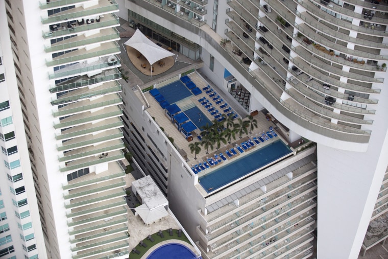 Deck chairs are lined up near swimming pools at the Trump Ocean Club International Hotel & Tower in Panama City