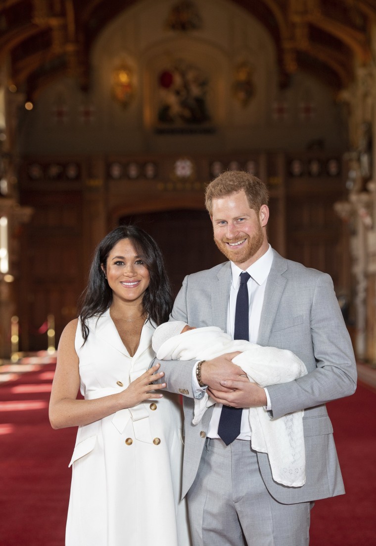 The Duke and Duchess of Sussex pose with their newborn son inside Windsor Castle.