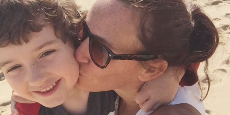 Heather Millen kisses her son