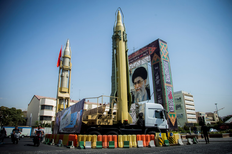 A display featuring missiles and a portrait of Iran's Supreme Leader Ayatollah Ali Khamenei