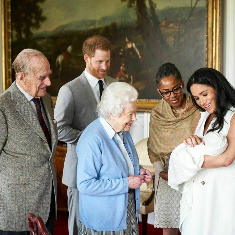 Image: Prince Harry and Meghan, Duchess of Sussex, introduce their son, Archie Harrison Mountbatten-Windsor, to Queen Elizabeth and Meghan's mother, Doria Ragland, at Windsor Castle on May 8, 2019.