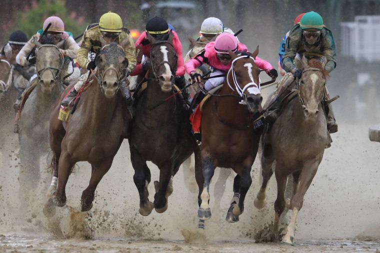 Image: Maximum Security, ridden by jockey Luis Saez, fights for position at the final turn of the Kentucky Derby at Churchill Downs on May 4, 2019.