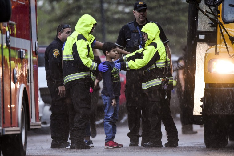 Image: Students are evacuated during a shooting at STEM School Highlands Ranch in Colorado on May 7, 2019.
