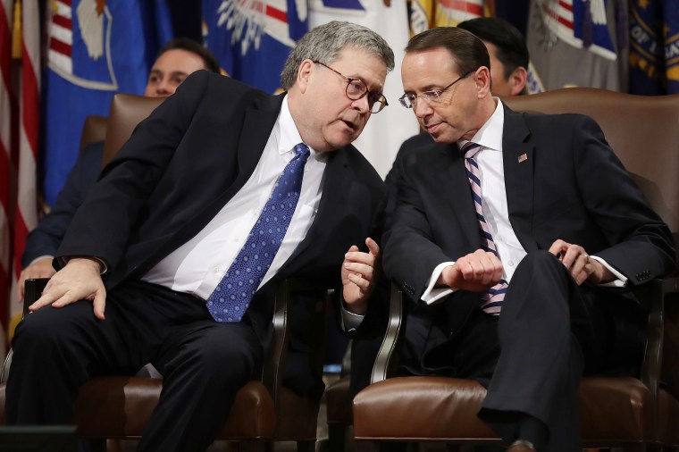 Image: Attorney General William Barr talks with Deputy Attorney General Rod Rosenstein during his farewell ceremony
