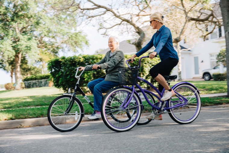 Mika Brzezinski and her mother, Emilie, ride bikes near their home in Florida.
