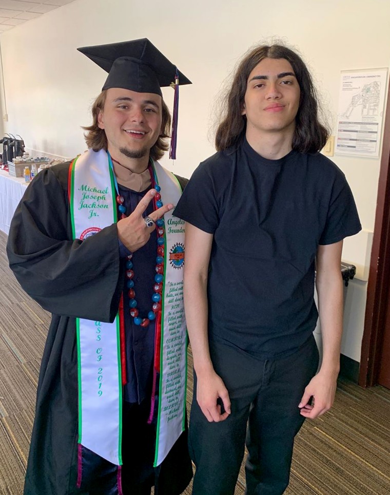 Prince Jackson, left, poses with his younger brother, Bigi, at his college graduation.