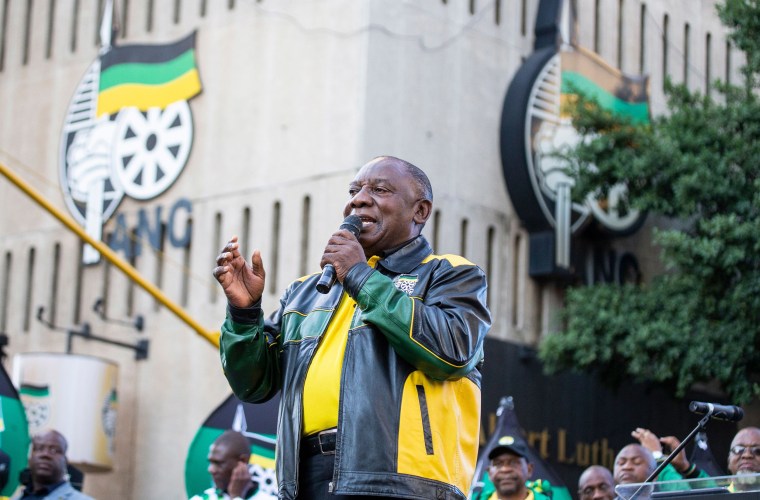 Image: President Elect of South Africa and President of the African National Congress Cyril Ramaphosa gestures as he delivers a speech outside Lithuli House, the ANC's headquarters in Johannesburg
