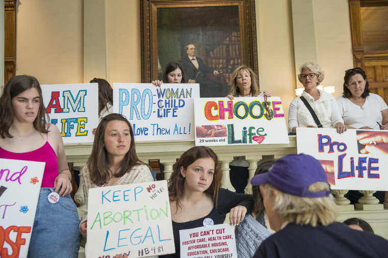Pro-abortion rights and anti-abortion demonstrators in the lobby of the Georgia State Capitol building in Atlanta on March 22, 2019.