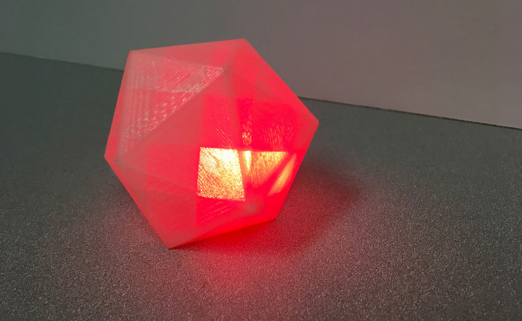 Image: A block-like geometric shape that emits a glowing red light when it hears swear words.