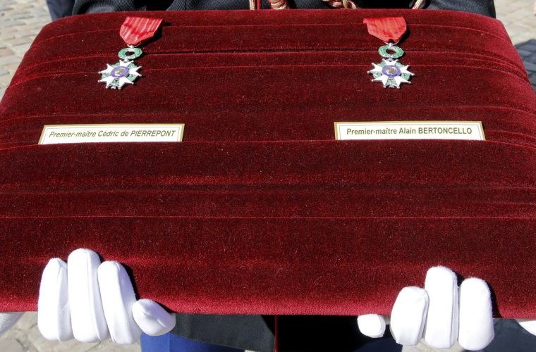 Image: The medals awarded to slain French commandos Cedric de Pierrepont and Alain Bertoncello