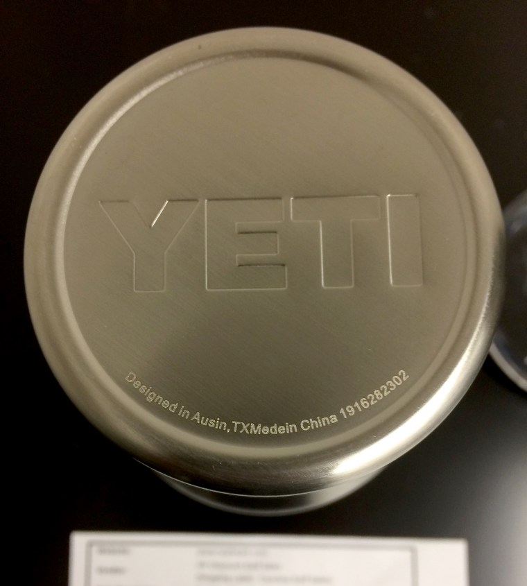 Image: A counterfeit Yeti tumbler with "Austin" and "made" spelled incorrectly.