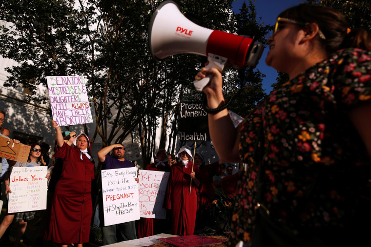 Image: Pro-choice supporters protest in front of the Alabama State House as Alabama state Senate votes on the strictest anti-abortion bill in the United States at the Alabama Legislature in Montgomery