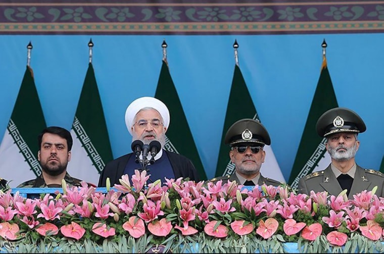 Image: Iranian President Hassan Rouhani delivers a speech during the ceremony of the National Army Day parade in Tehran