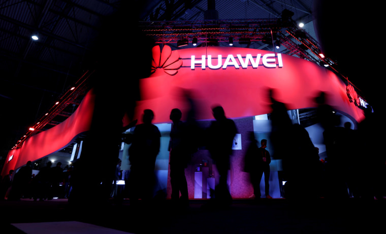 Image: Visitors walk past the Huawei booth at the Mobile World Congress in Barcelona on Feb. 27, 2017.
