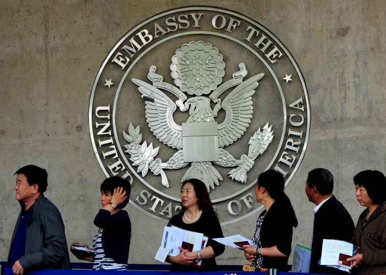 Image: Chinese citizens wait to submit visa applications at the United States Embassy in Beijing on May 2, 2012.