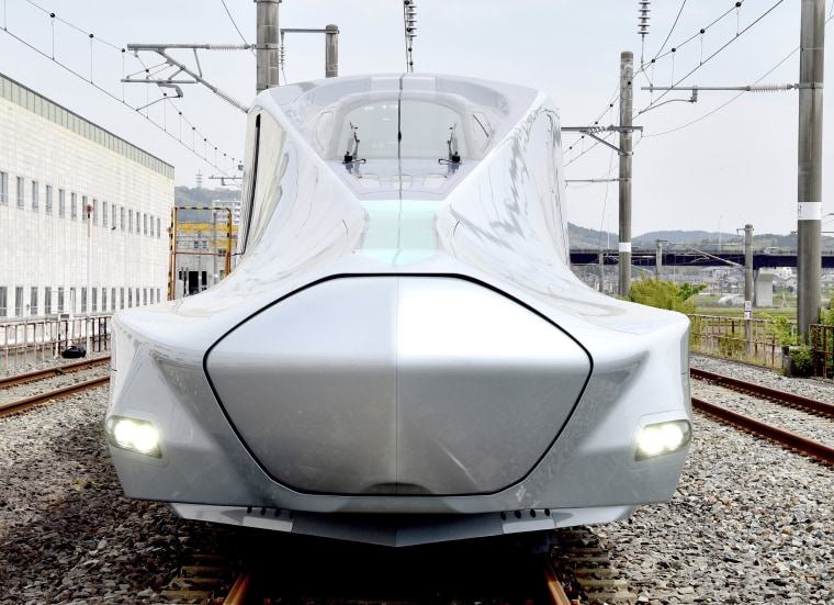 Image: A prototype of Japan's next-generation Shinkansen bullet train, set to be the fastest train on wheels when it enters service, reached speeds of 320 kilometres (198 miles) per hour on a test run on May 16