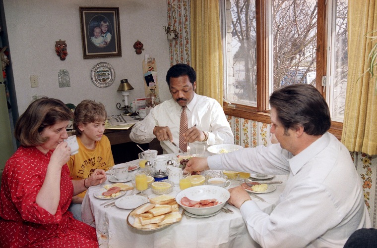 Image: Presidential candidate Jesse Jackson joins the Becker family for breakfast while campaigning in Cudahy, Wisconsin, on March 31, 1988.