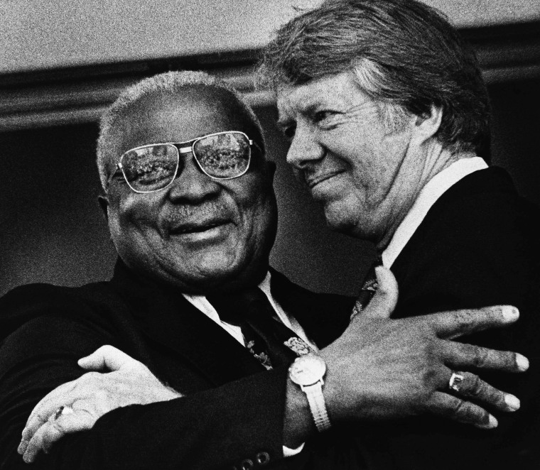 Image: Rev. Martin Luther King, Sr., hugs Democratic presidential candidate Jimmy Carter in Atlanta on April 13, 1976.