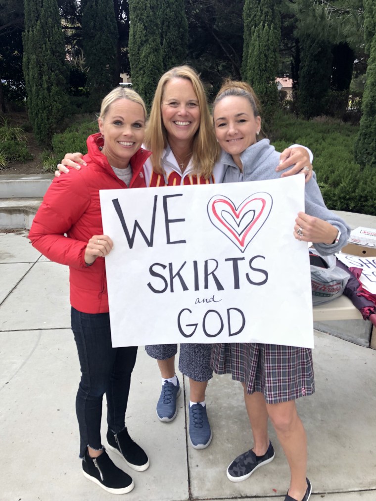 Moms (and several dads) joined their daughters to oppose the new skirt ban.