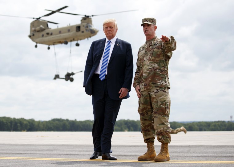 Image: President Donald Trump and Maj. Gen. Walter Piatt view air assault exercises at Fort Drum