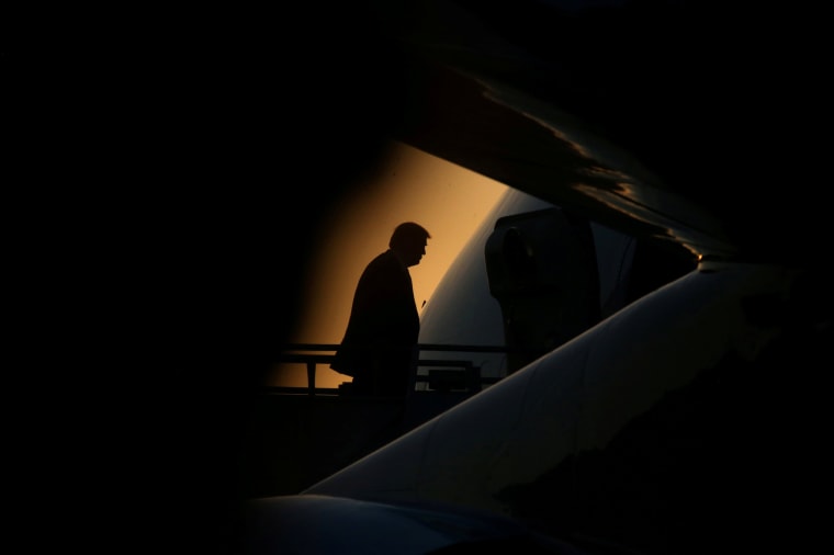 President Donald Trump boards Air Force One after a day of traveling around the state in Kenner, Louisiana