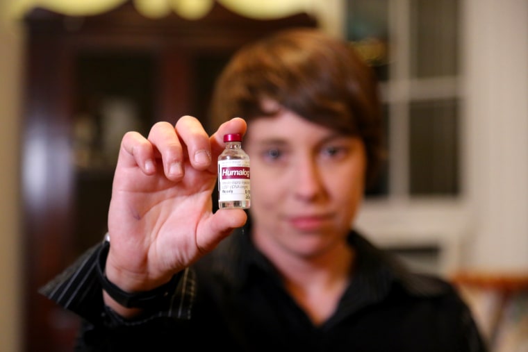 Image: Laura Marston holds up a vial of Humalog, a type of insulin, at her home in Washington, DC, on Sept. 27, 2016.