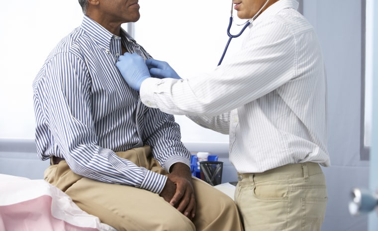 Doctor using a stethoscope on a patient listening to heart