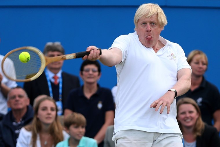 Image: London Mayor Boris Johnson laughs in action during the Rally Against Cancer charity match on day seven of the AEGON Championships at Queens Club