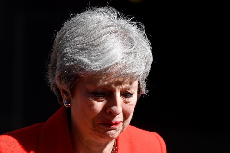 Image: British Prime Minister Theresa May reacts as she delivers a statement in London