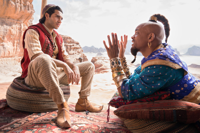 Mena Massoud as the street rat with a heart of gold, Aladdin, and Will Smith as the larger-than-life Genie in Disney's "Aladdin," directed by Guy Ritchie.