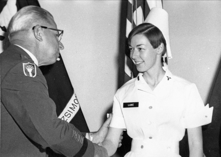 U.S. Army nurse Sharon Lane is congratulated by a military official as she's promoted to first lieutenant in Aurora, Colorado.
