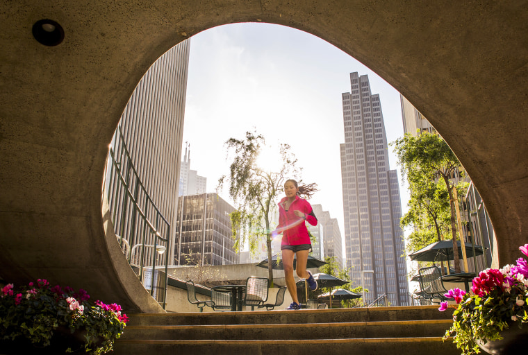 Woman running in urban park