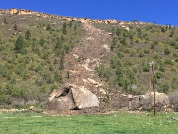 The boulders appeared to cut a giant path into a slope as they tumbled from the rim of a mountain onto a remote road in Colorado.